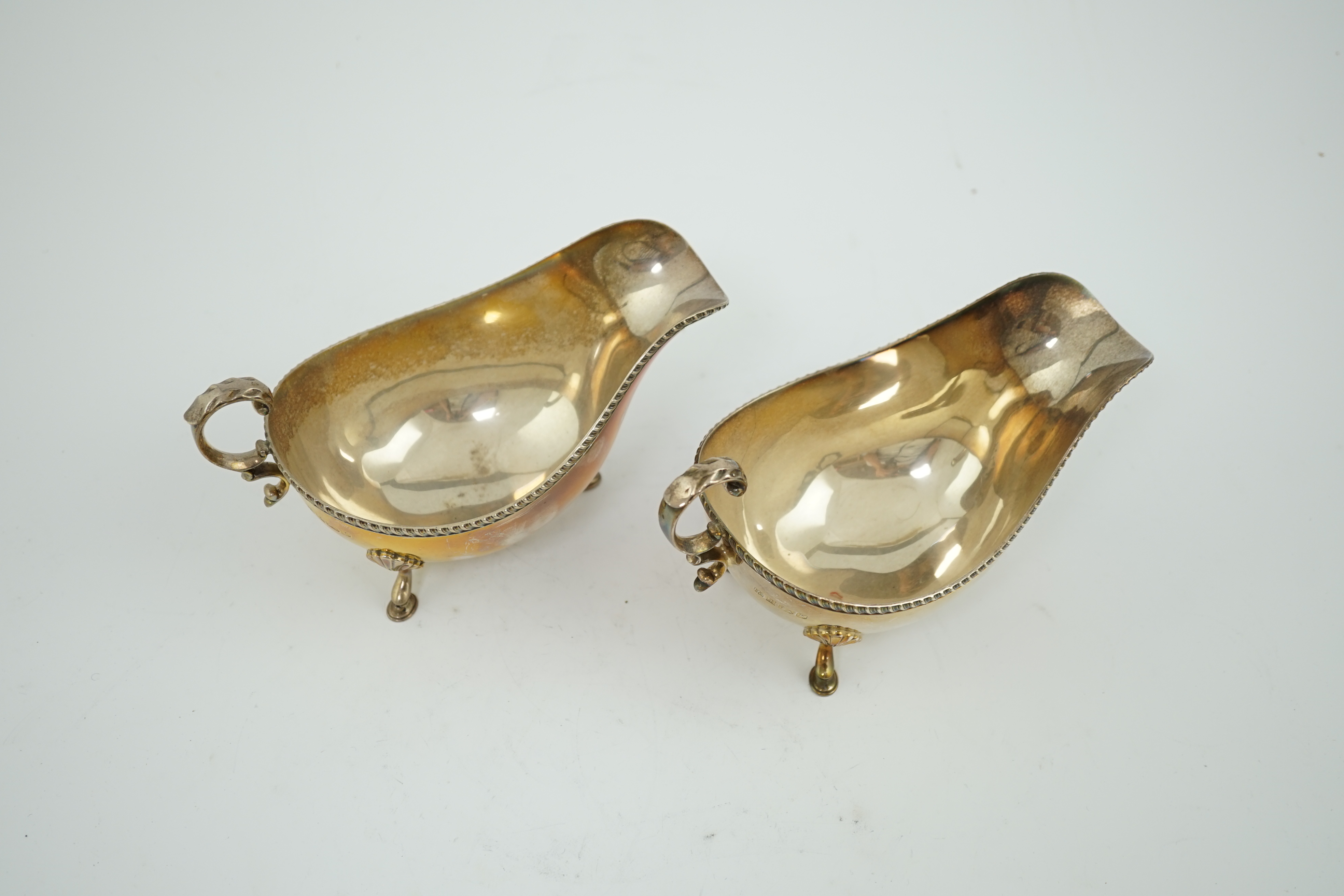 A pair of Elizabeth II silver sauce boats, by Barker Brothers Silver Ltd